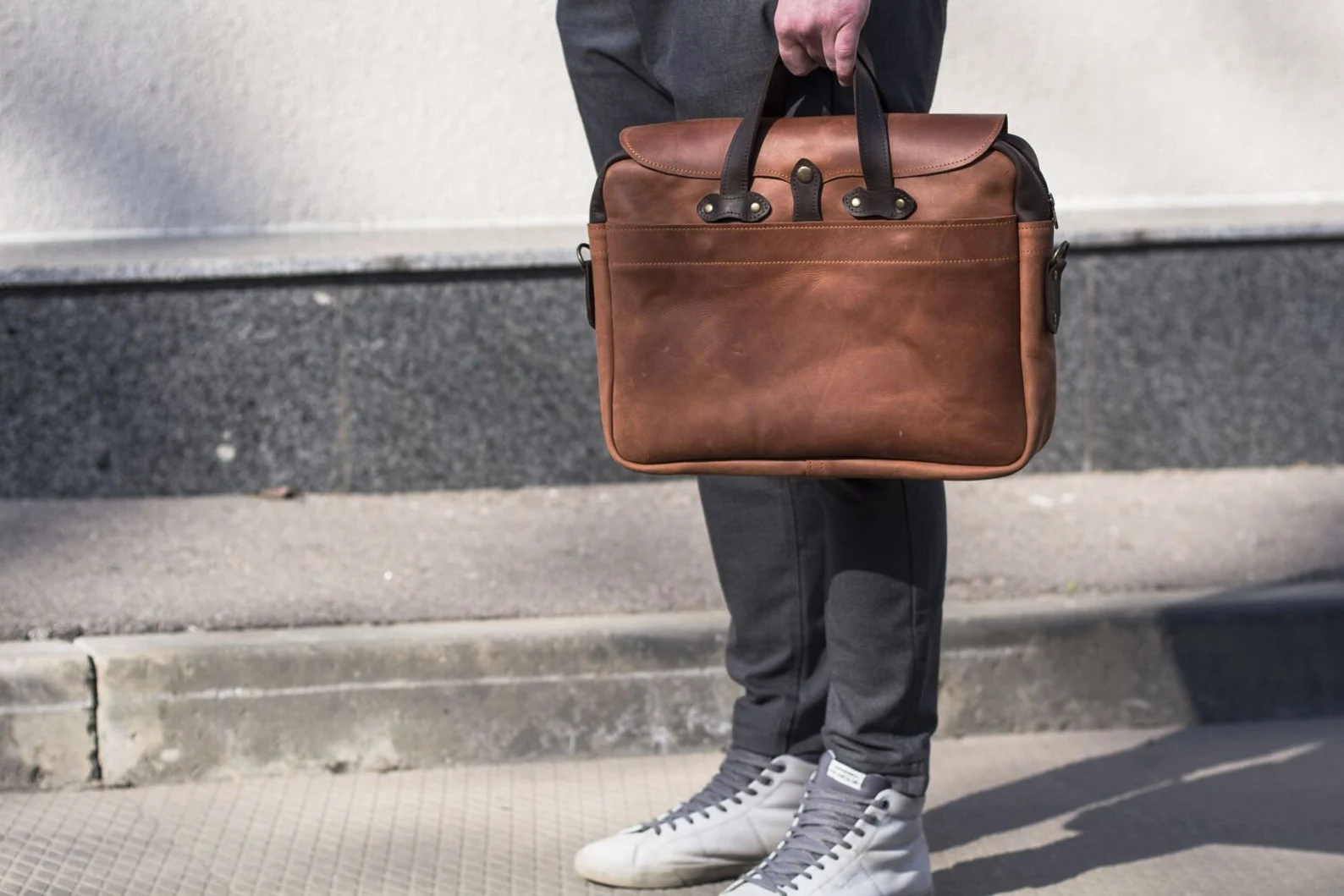 Men holding leather Briefcase Bags